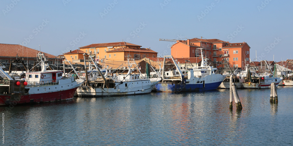 Chioggia, VE, Italy - February 11, 2018: fishing boats moored in the industrial port on the Adriatic sea