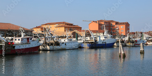 Chioggia, VE, Italy - February 11, 2018: fishing boats moored in the industrial port on the Adriatic sea