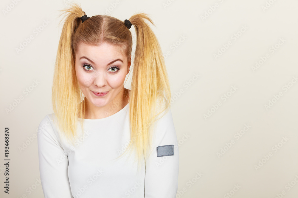 Happy blonde teenager girl with ponytails Happy blonde teenager girl with ponytails