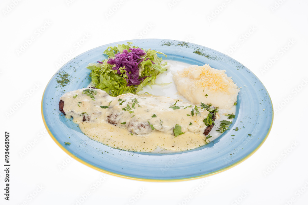 delicious grilled steak topped with cheese sauce served with salad and potato puree delicious grilled steak topped with cheese sauce served with salad and potato puree