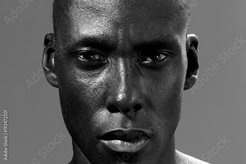 black and white photo of african american man staring