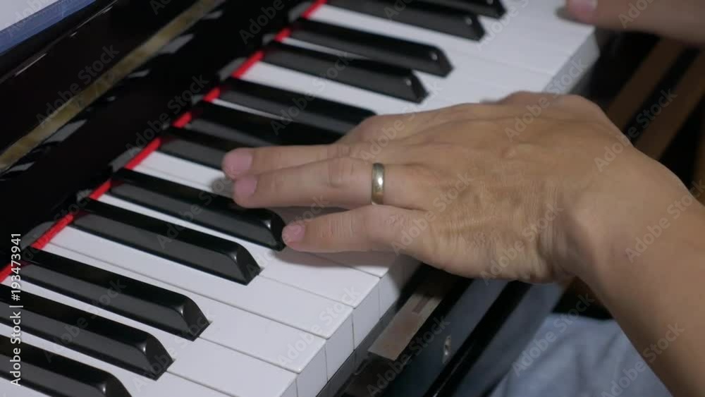 Pianist hands playing music. close up hands gentle pressing keys of piano. Pianist hands playing music. close up hands gentle pressing keys of piano.