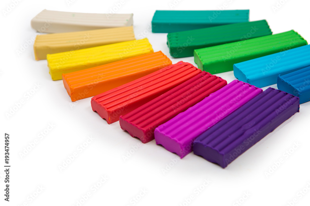 Fototapeta premium colored plasticine on isolated white background
