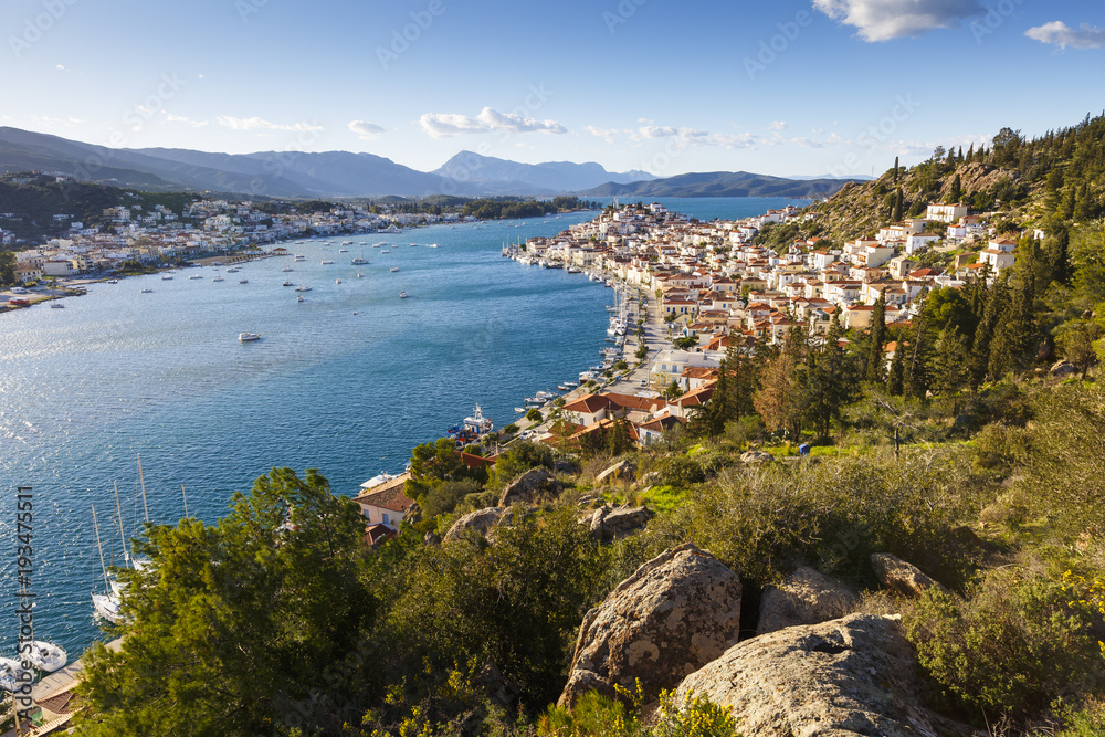 View of Poros island and mountains of Peloponnese peninsula in Greece. 
