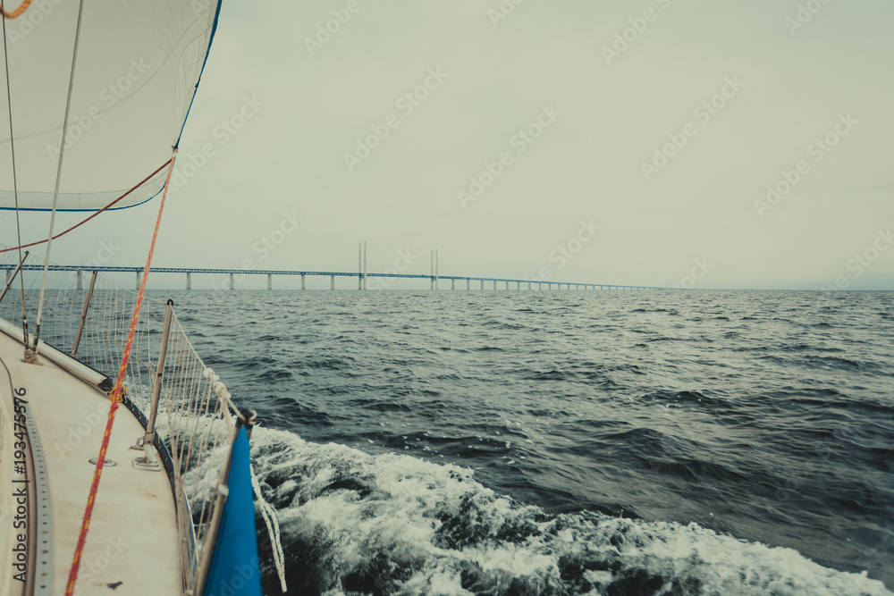 Fototapeta premium Yacht and oresund bridge between denmark sweden