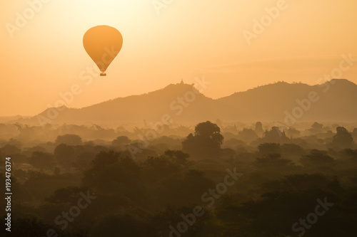 Balloon silhouette with sunrise over the ancient temples in Bagan, Myanmar