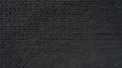 Crédence de cuisine Mur de briques Black wall as background, texture of a black brick wall  © Günter Albers