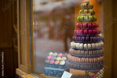  Macarons in the shop window of a small shop of a bakery
