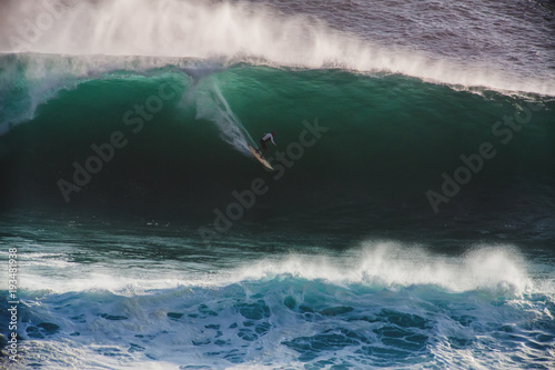Image Surfer on Blue Ocean Big Mavericks Wave in California photo