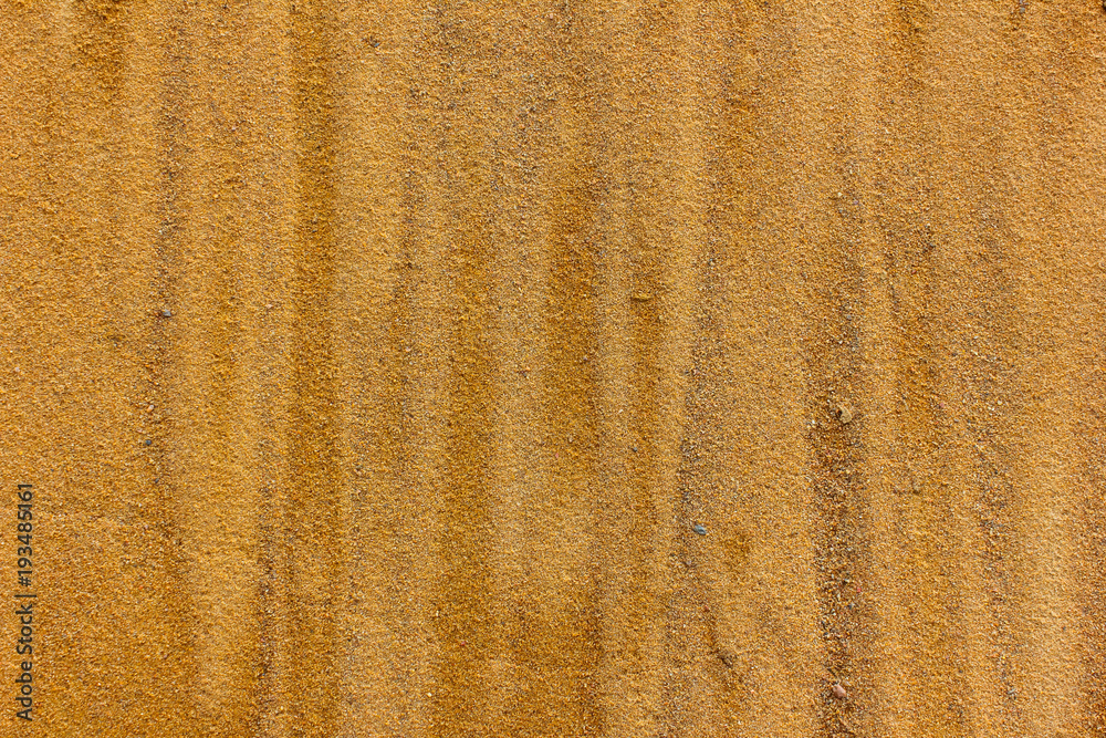 loose sand. Beach, wet, sand close-up. Divorces in the sand. loose sand. Beach, wet, sand close-up. Divorces in the sand.