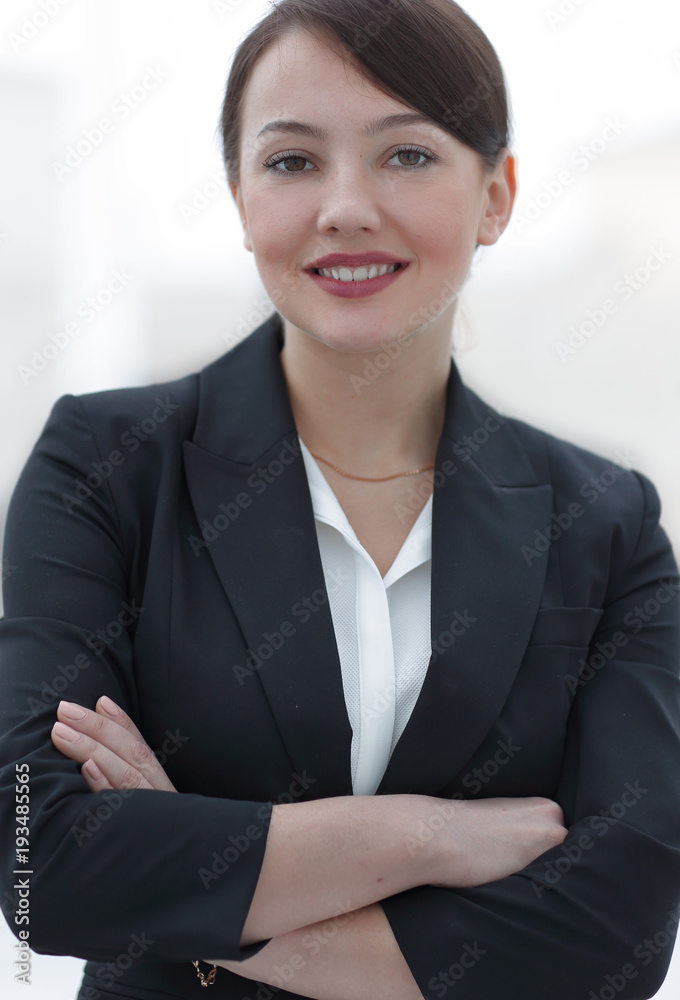 successful young business woman on the background of the office. successful young business woman on the background of the office.