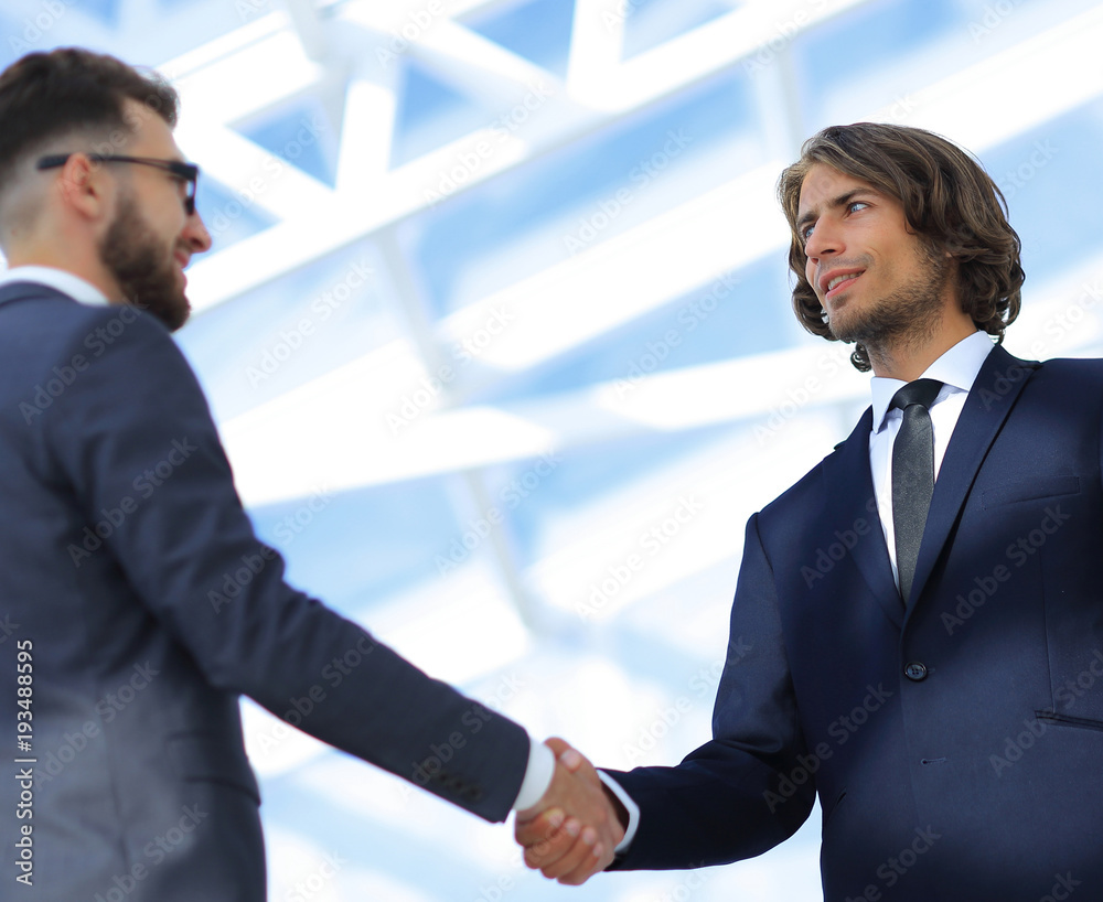 Business handshake and business people. Business handshake and business people.