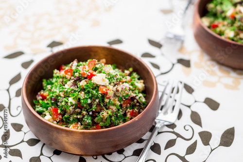 Greek style tabbouleh salad. This healthy dish mixes tabbouleh & greek style salads, using fresh parsley herb, olives, onions, feta and replacing the bulgur usually found in tabouleh with quinoa.