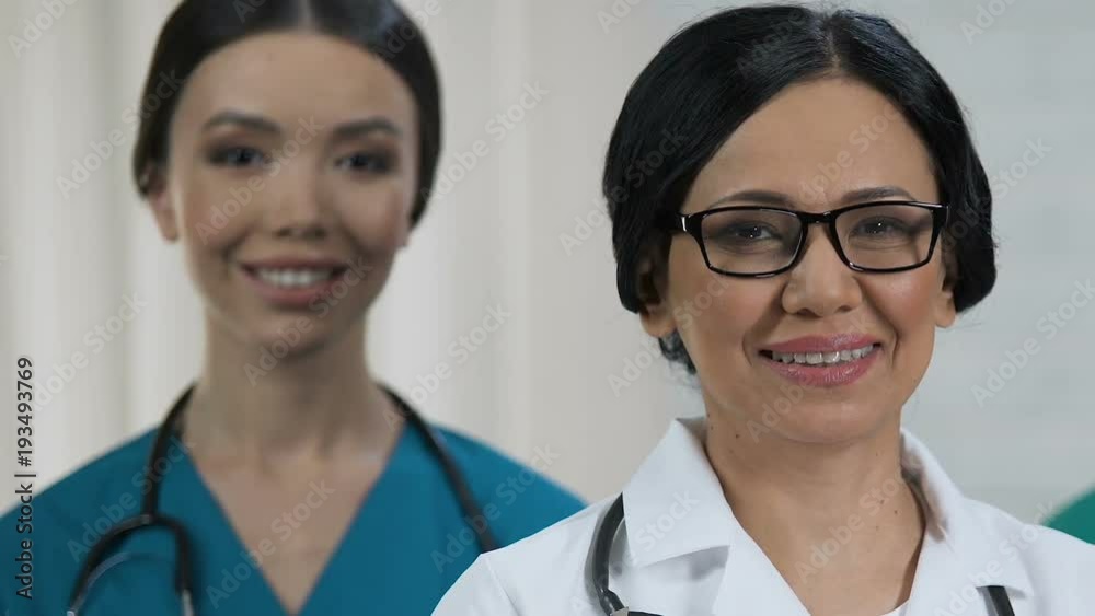 Friendly female medical staff smiling at camera, health care system, profession Friendly female medical staff smiling at camera, health care system, profession
