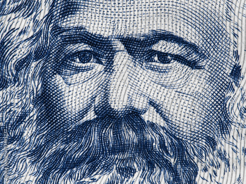 Karl Marx portrait on East German 100 mark (1975) banknote closeup macro, famous philosopher, economist, political theorist, sociologist and revolutionary socialist.. photo