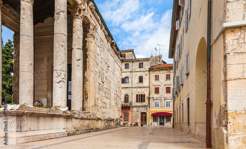Old houses in background of the ancient Roaman temple of Augustus in old town Pula city, Croatia. © Romas Vysniauskas