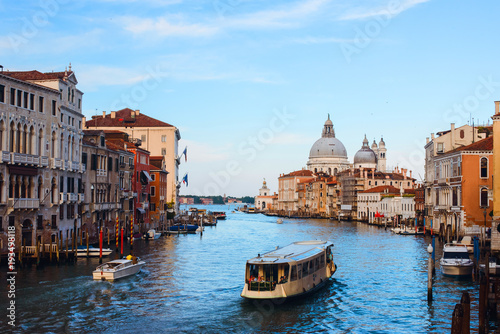 Beautiful panoramic view over the famous Grand canal in Venice, surrounded by old and romantic architecture illuminated by sun, in Italy. Natural colors © ANR Production
