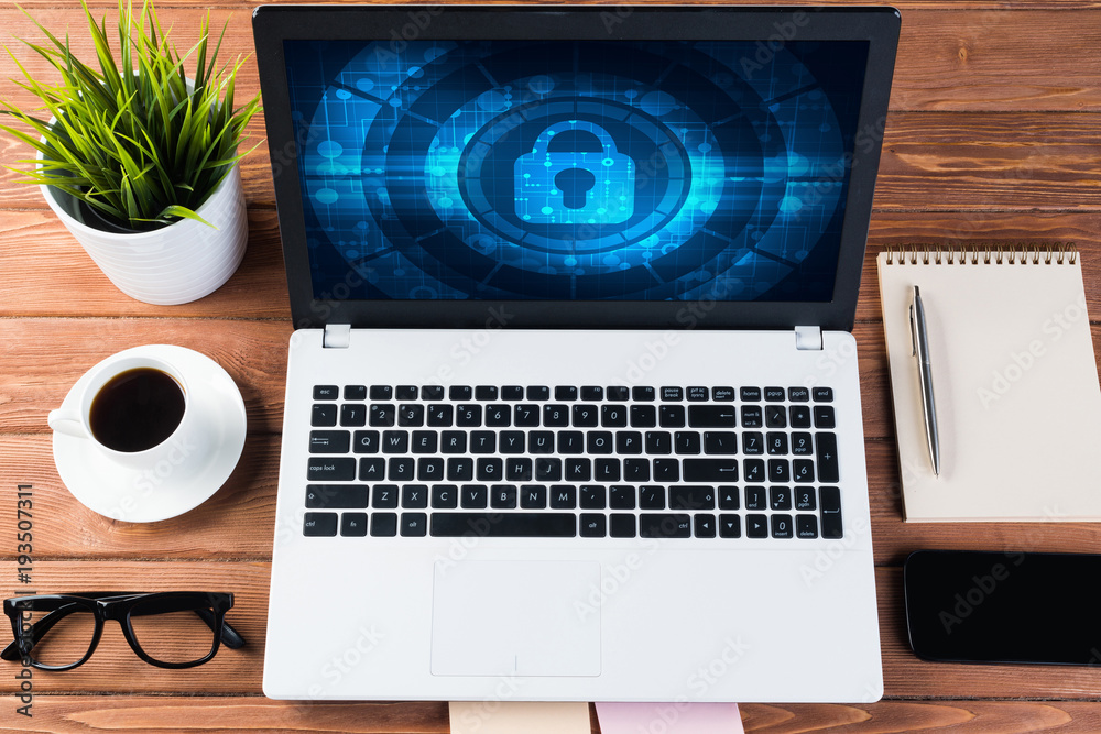 Web security and technology concept with laptop on wooden table Web security and technology concept with laptop on wooden table