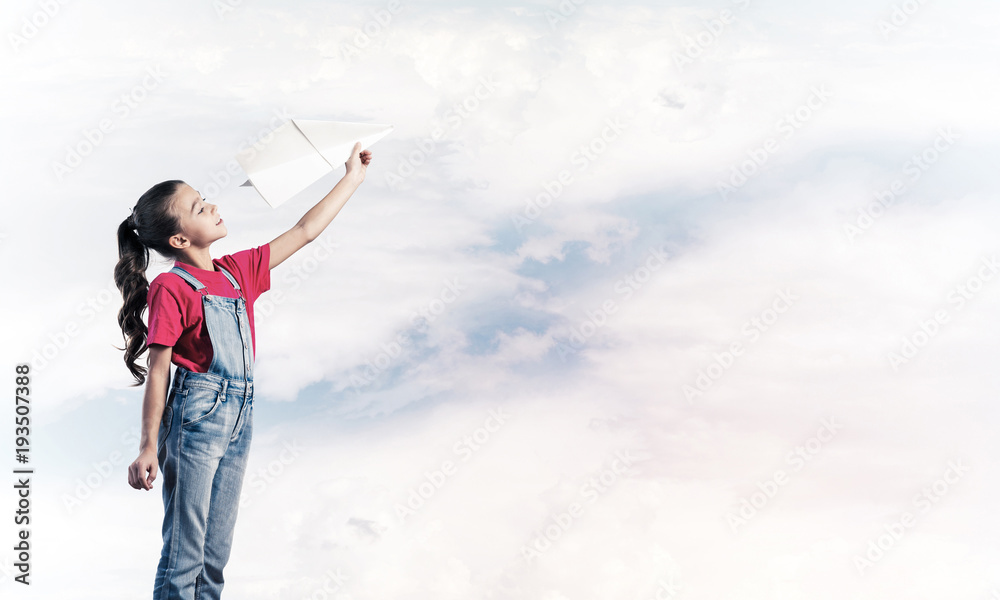 Concept of careless happy childhood with girl dreaming to become Concept of careless happy childhood with girl dreaming to become