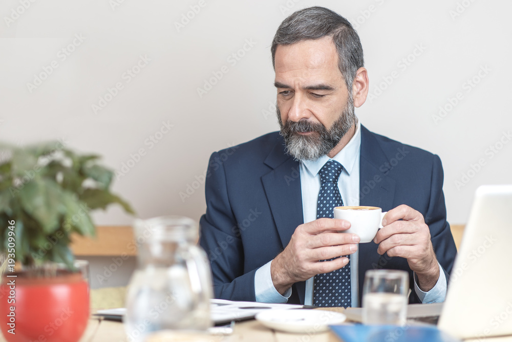Casual morning coffee for a senior business man Casual morning coffee for a senior business man