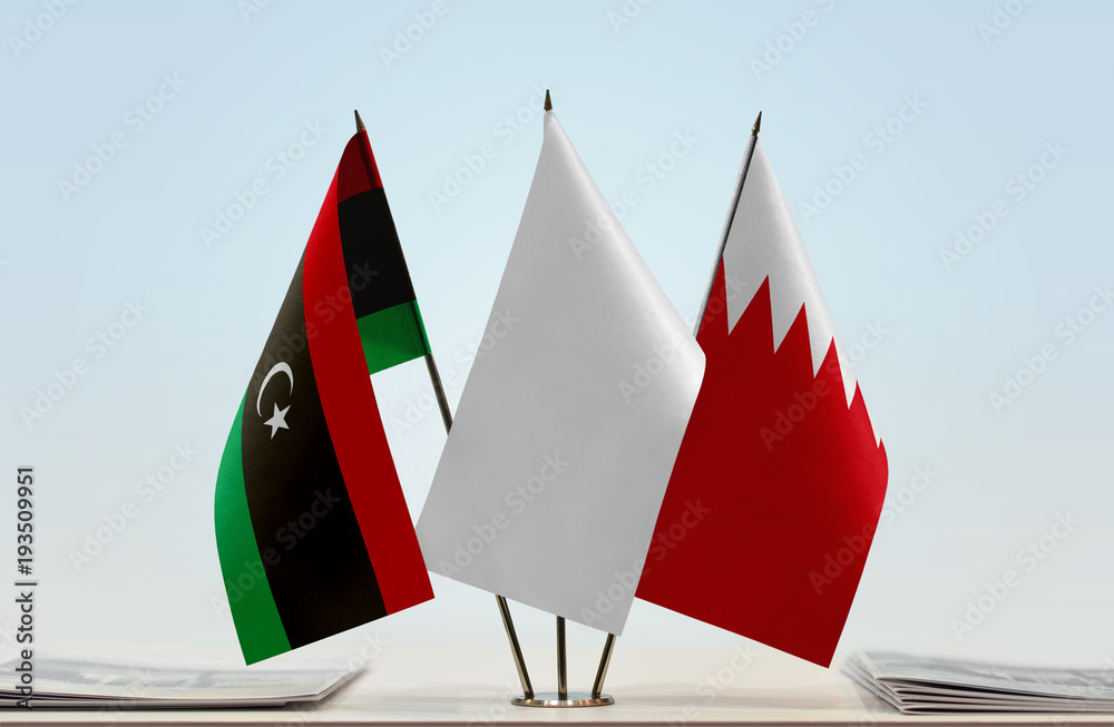 Flags of Libya and Bahrain with a white flag in the middle Flags of Libya and Bahrain with a white flag in the middle
