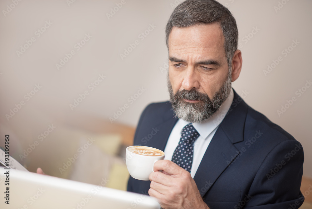Casual morning coffee for a senior business man Casual morning coffee for a senior business man
