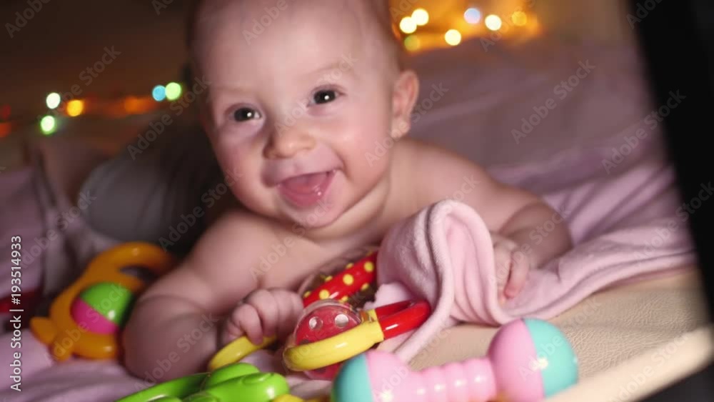 Sweet baby with toy on the sofa at home. Sweet baby with toy on the sofa at home.