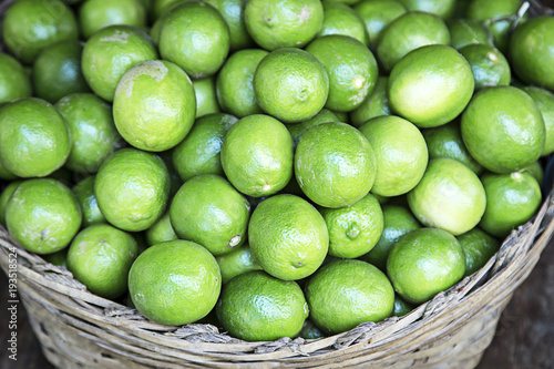 green lemons on the old basket