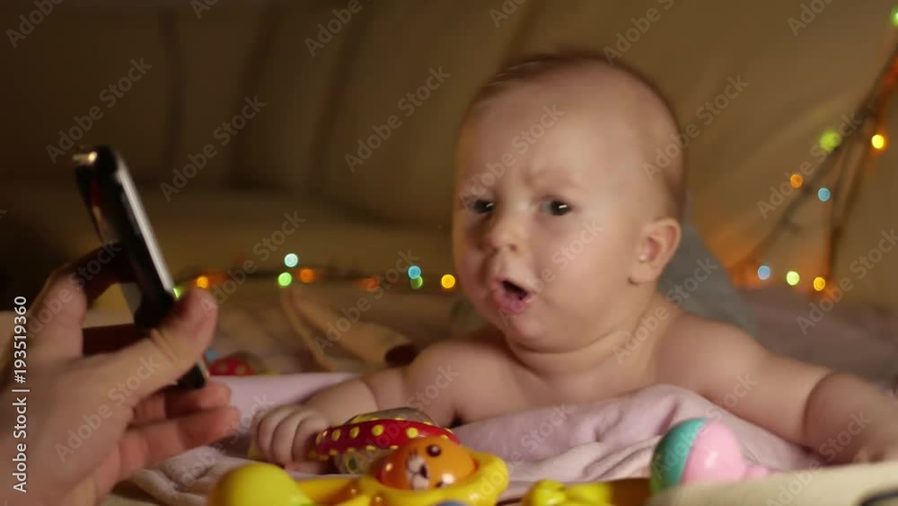 Sweet baby with toy on the sofa at home. Sweet baby with toy on the sofa at home.