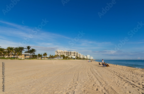 Beach at Lauderdale By The Sea and Pompano in Florida, with the view of Hillsboro lighthouse