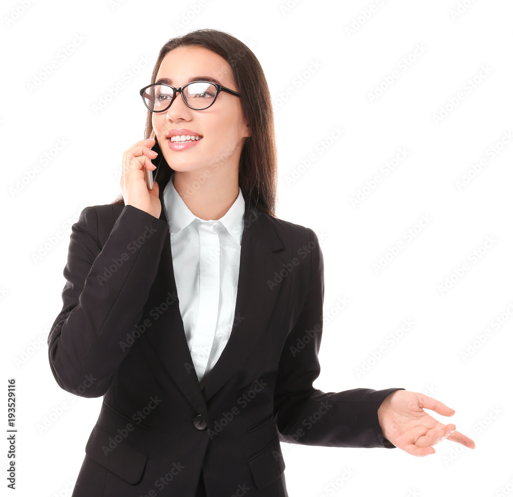 Beautiful young woman in elegant suit talking by mobile phone on white background Beautiful young woman in elegant suit talking by mobile phone on white background