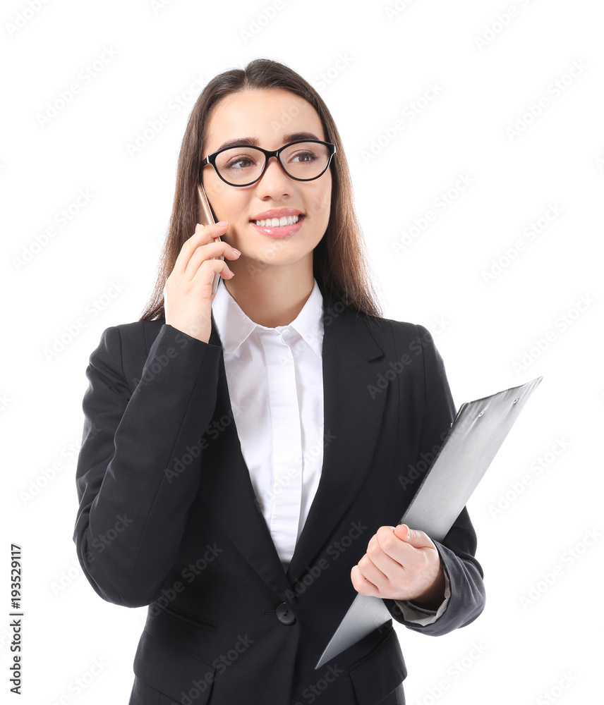 Beautiful young woman in elegant suit talking by mobile phone on white background Beautiful young woman in elegant suit talking by mobile phone on white background