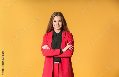 Beautiful fashionable woman in elegant suit on color background © Africa Studio
