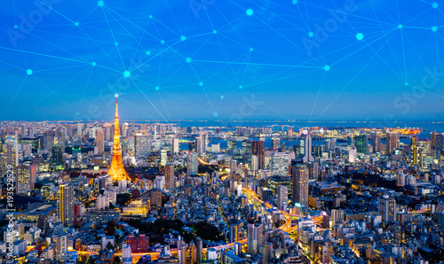 Photography Business concept for information, communication , connection technology - panoramic modern city skyline, bird eye aerial night view under beautiful dark blue night sky in Roppongi Hill, Tokyo, Japan