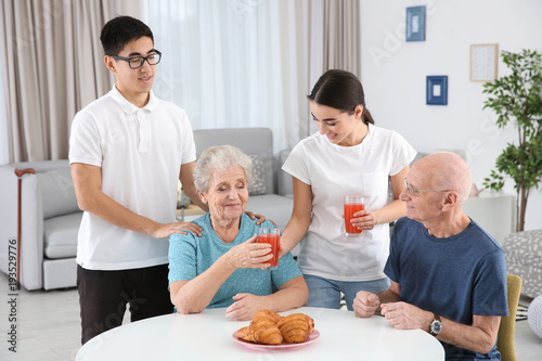 Senior people with young ca...