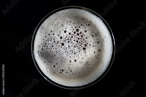 Top view glass of beer, beer foam and bubbles texture