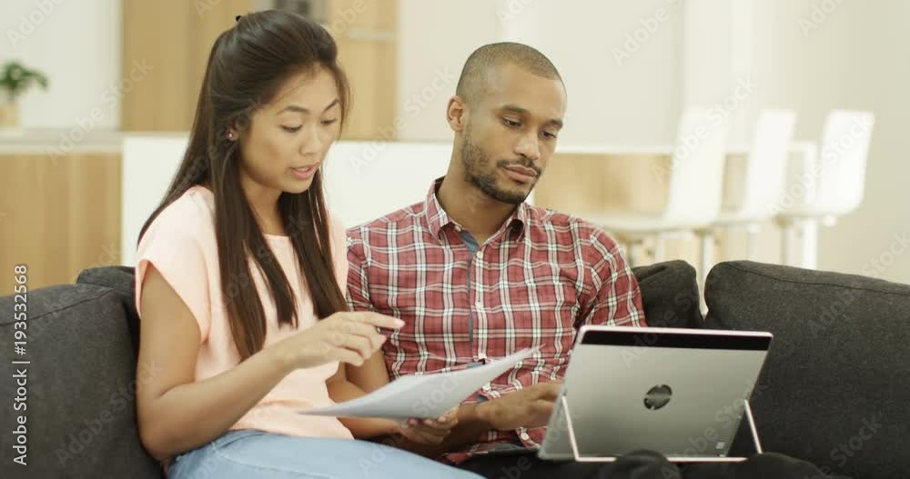4k, Worried young couple arguing with each othera and going through their pending bills in disbelief. 4k, Worried young couple arguing with each othera and going through their pending bills in disbelief.