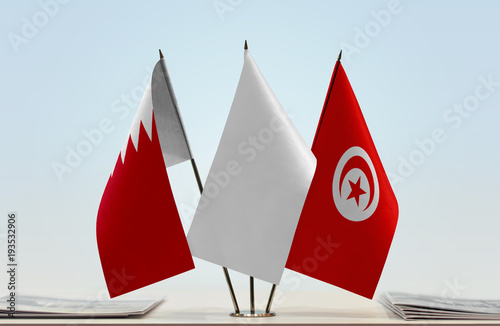 Flags of Bahrain and Tunisia with a white flag in the middle