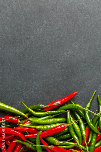 Hot red and green chilli background, top view. photo