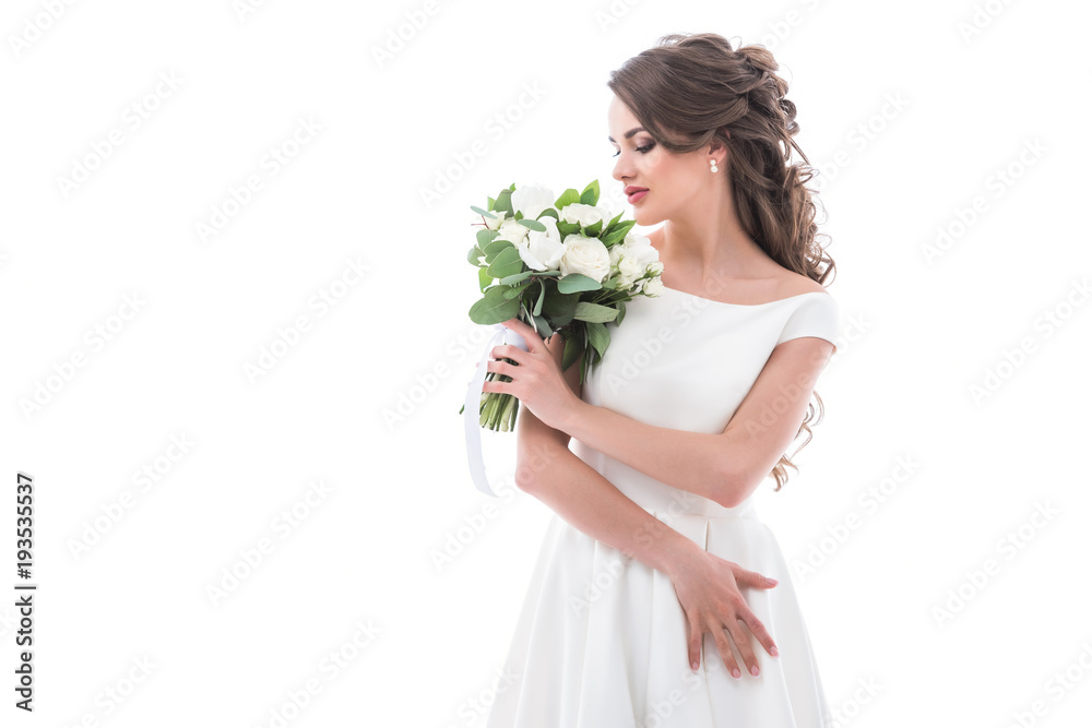 elegant bride posing in traditional white dress with wedding bouquet, isolated on white