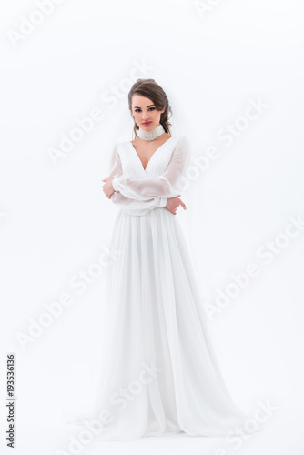brunette bride posing in elegant wedding dress, isolated on white