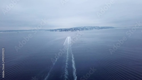 Tracking shot of a ferry boat in Oslofjord near Lysaker in Oslo photo