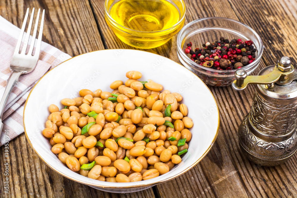 Canned white beans on wooden table Canned white beans on wooden table