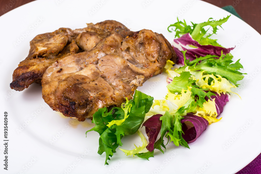 Concept of protein-carbohydrate nutrition. Chicken meat with lettuce