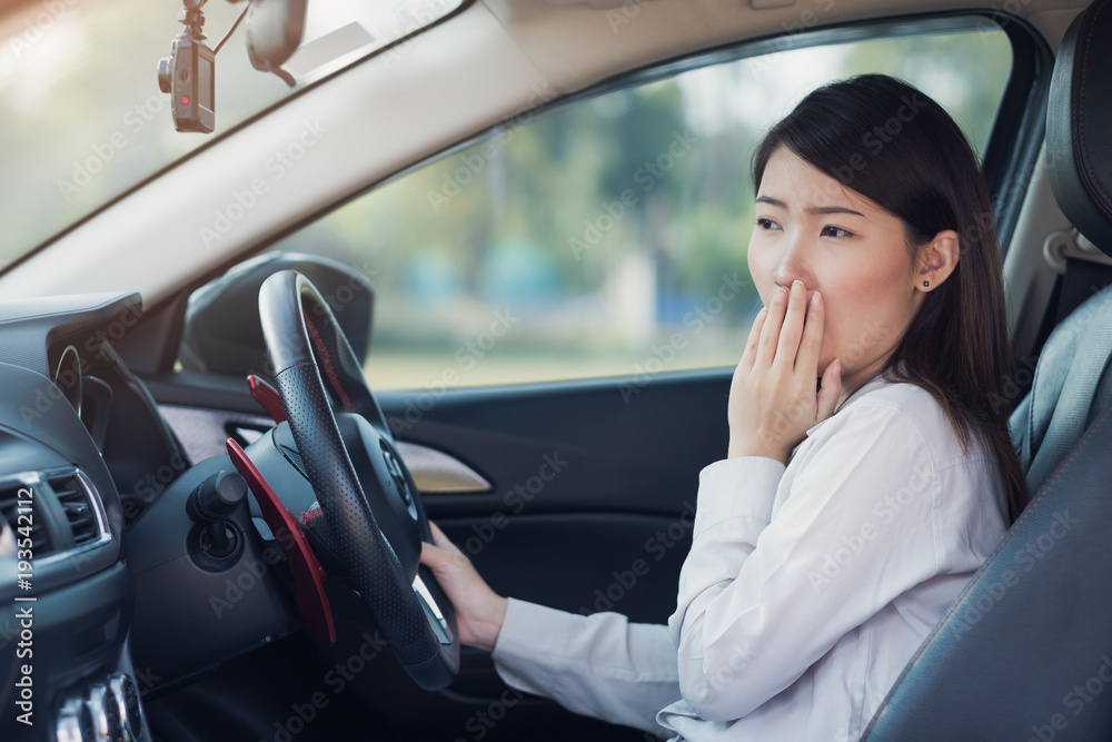 Businesswoman feel tried sleeping in a car