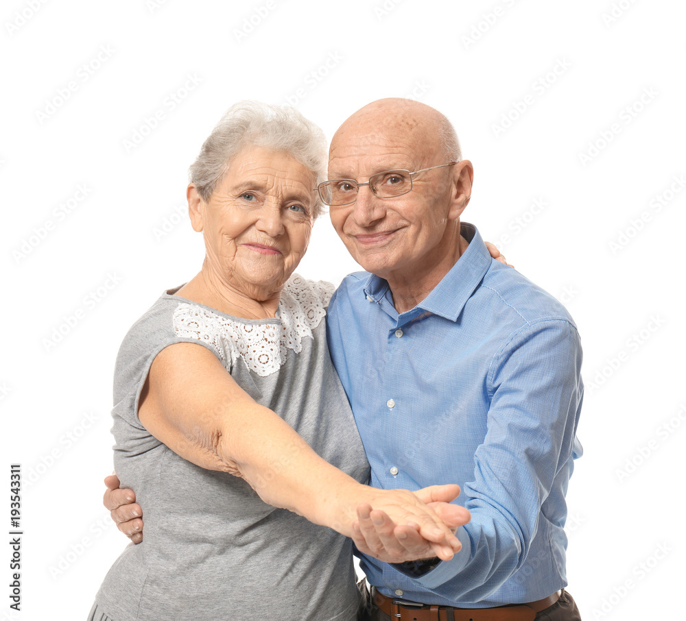 Cute elderly couple dancing against white background Cute elderly couple dancing against white background