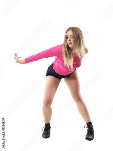 Dancing flexible bending blonde woman jazz dancer with stretched arm looking down. Full body length portrait isolated on white studio background. 