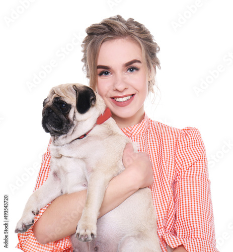 Young woman with cute pug d...