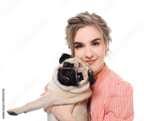 Young woman with cute pug d...