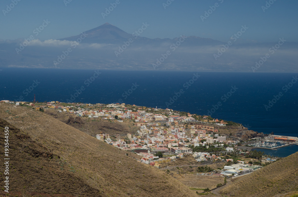 San Sebastián de La Gomera (island of La Gomera) in the foreground and Teide summit (island of Tenerife) in the background. Canary Islands. Spain.